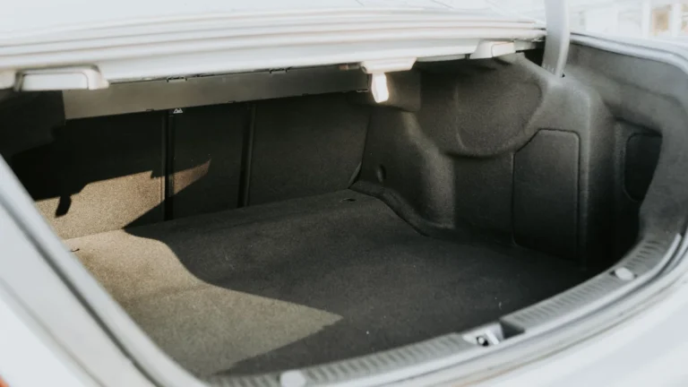 Open car trunk prepared for sound deadening